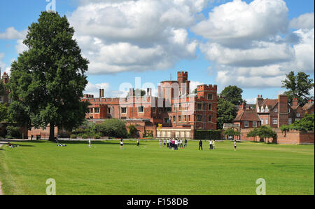 Teenagers playing games in front of historic Eton College in Berkshire, England Stock Photo
