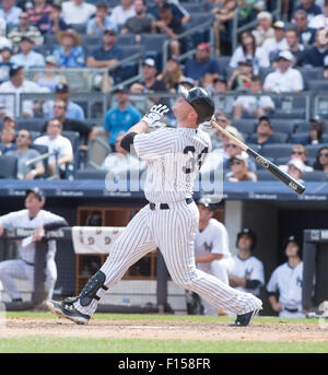 New York Yankees' Brian McCann, right, is congratulated by Garrett ...