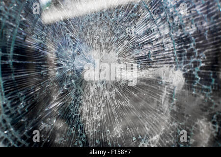 Broken glass window of a local vending machine at a train station Stock Photo