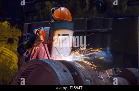 welder is welding a steel plate Stock Photo