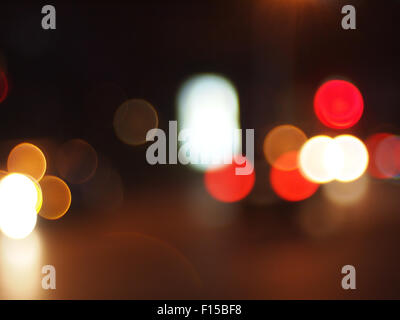 Defocused lights from the headlights and tail lights of cars on the road was blurred for use as a background Stock Photo