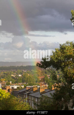 Wimbledon London, UK. 27th August 2015. A rainbow appears over rooftops after a brief storm in Wimbledon Credit:  amer ghazzal/Alamy Live News Stock Photo