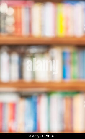 defocused background from book shelves with many books Stock Photo