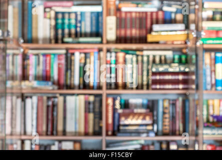 blurred background from many books at bookracks Stock Photo