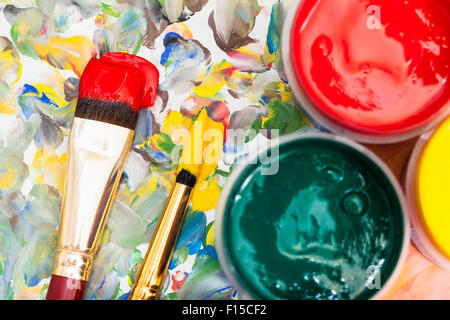 art background - watercolor palette, jars with gouache, two paint brushes Stock Photo