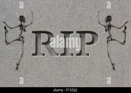 Engraved headstone spelling the letters RIP with Skeletons - rest in peace Stock Photo