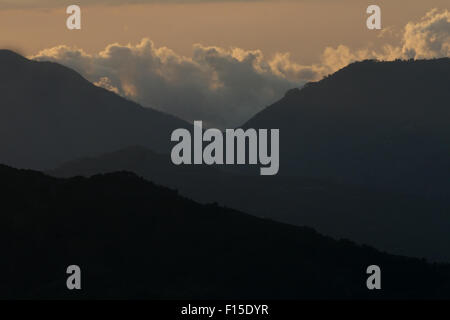 Cloud forest Sunset on Coffee Plantation, Mirador de Quetzales, Costa Rica. Stock Photo