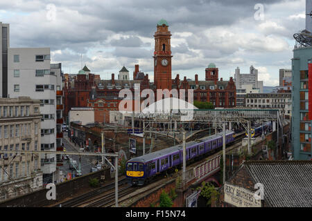 A Northern Rail commuter train leaves Manchester Oxford Road railway station in Manchester city centre UK Stock Photo