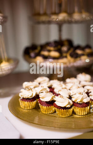 Close-up of Red Velvet Cupcakes on Dessert Table Stock Photo
