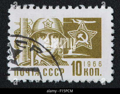 CCCP 10Kon 1966 soldier army olive colour color hammer sickle USSR Soviet stamp Stock Photo