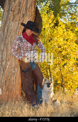 Portrait of Cowgirl with Dog, Shell, Wyoming, USA Stock Photo