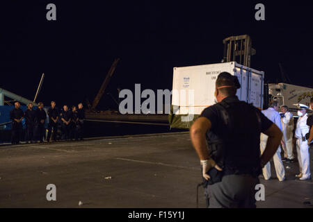 Palermo, Italy. 27th Aug, 2015. A container with the bodies of migrants is unloaded from Swedish Coast Guards ship 'Poseidon' in the port of Palermo on August 27, 2015 following a rescue operation of migrants in the Meditterranean sea. © Antonio Melita/Pacific Press/Alamy Live News Stock Photo