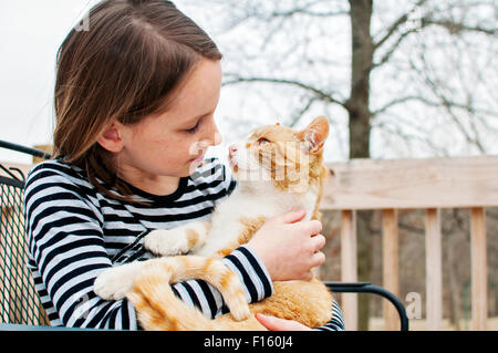 A girl and her cat Stock Photo