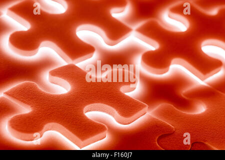Background of large shining puzzles in red Stock Photo