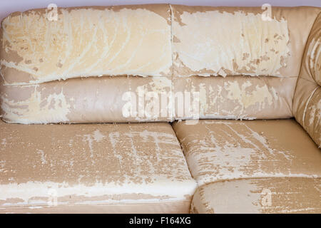 Beige damaged or cracked synthetic leather texture. Stock Photo