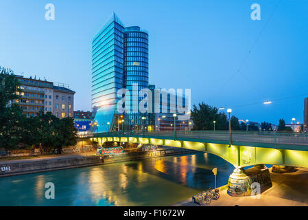 Austria, Vienna Urania, Uniqa Tower and danube channel in the evening Stock Photo