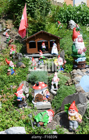 Garden gnomes in a garden of a house at Engelberg on the Swiss alps Stock Photo