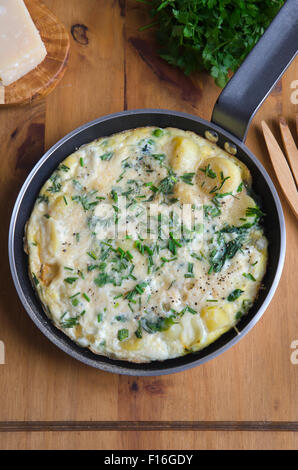 Pea, spinach and potato frittata Stock Photo