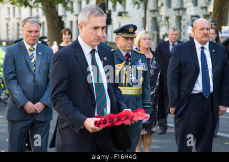 Whitehall, London, UK. 28th August, 2015.  Six wreaths are laid at the Cenotaph by representatives from the Armed Forces, the RFL, the Parliamentary Rugby League Group and Ladbrokes Challenge Cup finalists Hull Kingston Rovers and Leeds Rhinos, ahead of Saturday’s Ladbrokes Challenge Cup Final at Wembley. PICTURED: Greg Mulholland MP, the chairman of the Parliamentary Rugby League Group. Credit:  Paul Davey/Alamy Live News Stock Photo