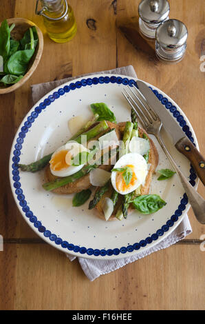 Soft-boiled egg, asparagus and Pecorino on toast Stock Photo