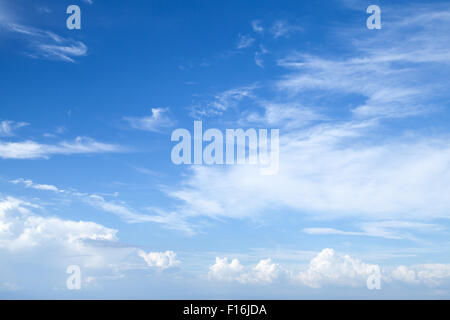 Cirrus and stratocumulus. Bright blue sky with different types of clouds, natural background photo Stock Photo