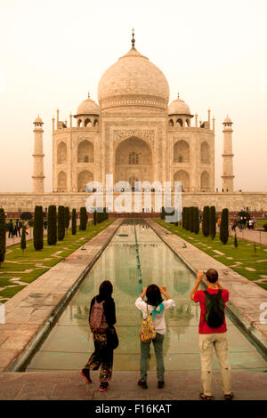 Tourists take pictures of the Taj Mahal, India Stock Photo