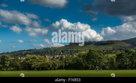 Looking up towards the famous countryside landmark, The Cow & Calf Rocks, from Ilkley on a beautiful day. Stock Photo