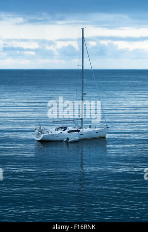 Baltimore Yacht Charters yacht moored in early morning light off Cape Clear Island in west Cork, Ireland Stock Photo