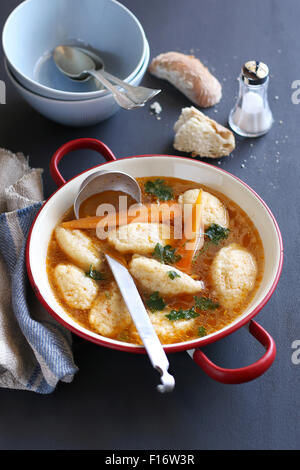 Semolina dumpling soup in an enamel pan Stock Photo