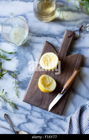 Sliced lemon on a chopping board. Stock Photo