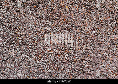 background made of a closeup of a wall plastered with a dry dash aggregates coating Stock Photo