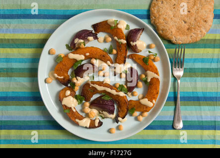 Moroccan squash salad with tahini and lemon dressing. Stock Photo