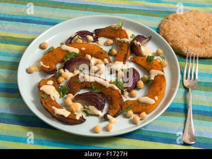 Moroccan squash salad with tahini and lemon dressing. Stock Photo