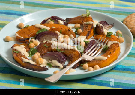 Moroccan squash salad with tahini and lemon dressing. Stock Photo