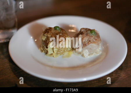 Two Chinese dumplings shumai on plate. Stock Photo