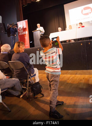 Exeter Devon UK 28 August 2015 Jeremy Corbyn addresses Labour Party Leadership Rally. Young boy taking a photograph on a smart phone Stock Photo