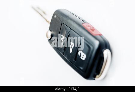 Car Ignition Key with Built-In Remote Locking. Car Keys Isolated on White. Stock Photo