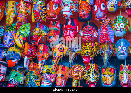 Mayan wooden masks for sale at Chichicastenango market in Guatemala. Stock Photo