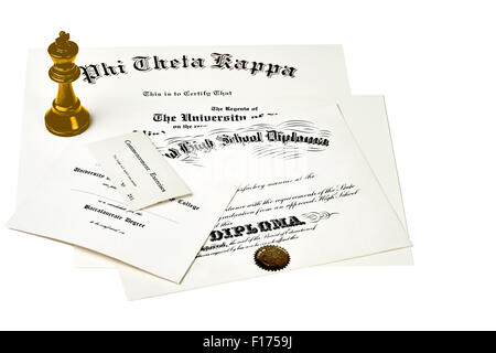 Education certification documents including high school diploma,commencement ticket, fraternity certification and university deg Stock Photo