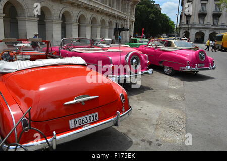 Line of soft top vintage cars used for tourist taxi tours Havana Cuba Stock Photo