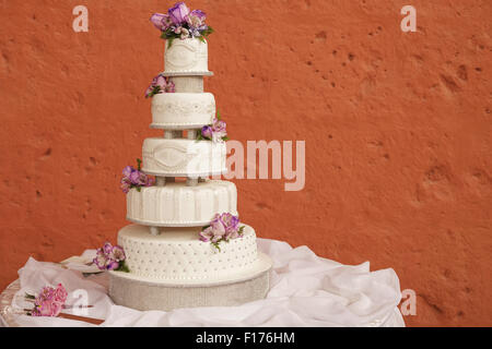 White wedding cake decorated with flowers Stock Photo