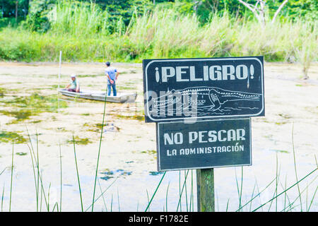 Crocodile warning sign near an artificial pond in Tikal Guatemala's national park Stock Photo