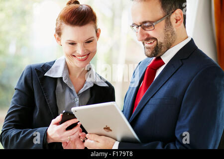 Two business people discussing work Stock Photo