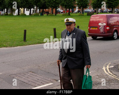 Grumpy looking old man with sailors cap, Marlborough, Wiltshire, UK Stock Photo