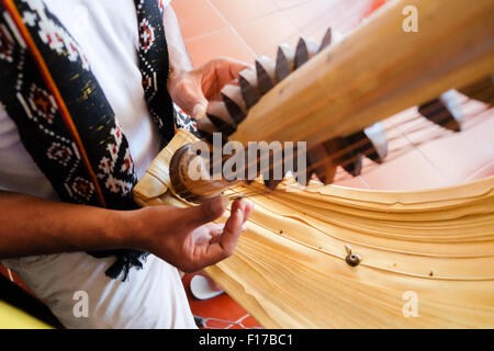 Man playing traditional sasando music instrument. Kupang, West Timor, Indonesia. © Anastasia Ika Stock Photo