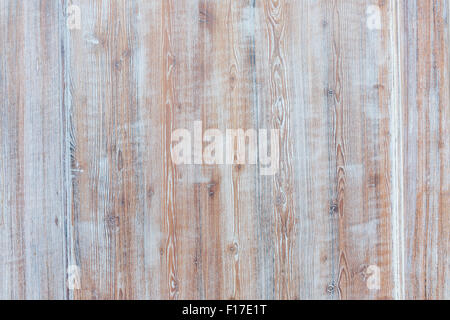 Aged wooden background of weathered distressed rustic wood boards with faded light blue paint showing brown woodgrain texture Stock Photo