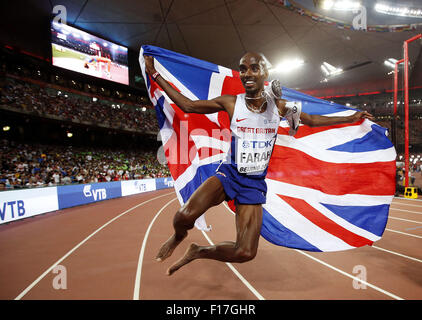 Beijing, China. 29th Aug, 2015. Britain's Mohammed Farah celebrates winning the men's 5000m final at the 2015 IAAF World Championships at the 'Bird's Nest' National Stadium in Beijing, capital of China, Aug. 29, 2015. Credit:  Wang Lili/Xinhua/Alamy Live News Stock Photo