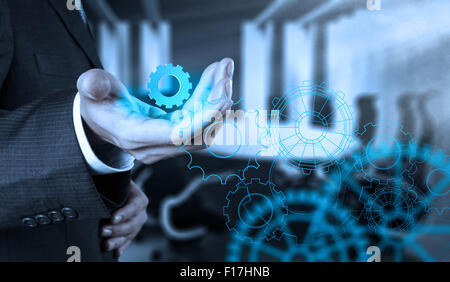 businessman hand draws gear to success concept Stock Photo - Alamy