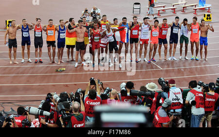 Beijing, China. 29th Aug, 2015. Athletes take photos after the men's decathlon at the 2015 IAAF World Championships at the 'Bird's Nest' National Stadium in Beijing, capital of China, Aug. 29, 2015. Credit:  Li Wen/Xinhua/Alamy Live News Stock Photo