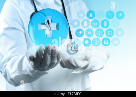 scientist doctor hand shows virtual first aid sign in the lab Stock Photo